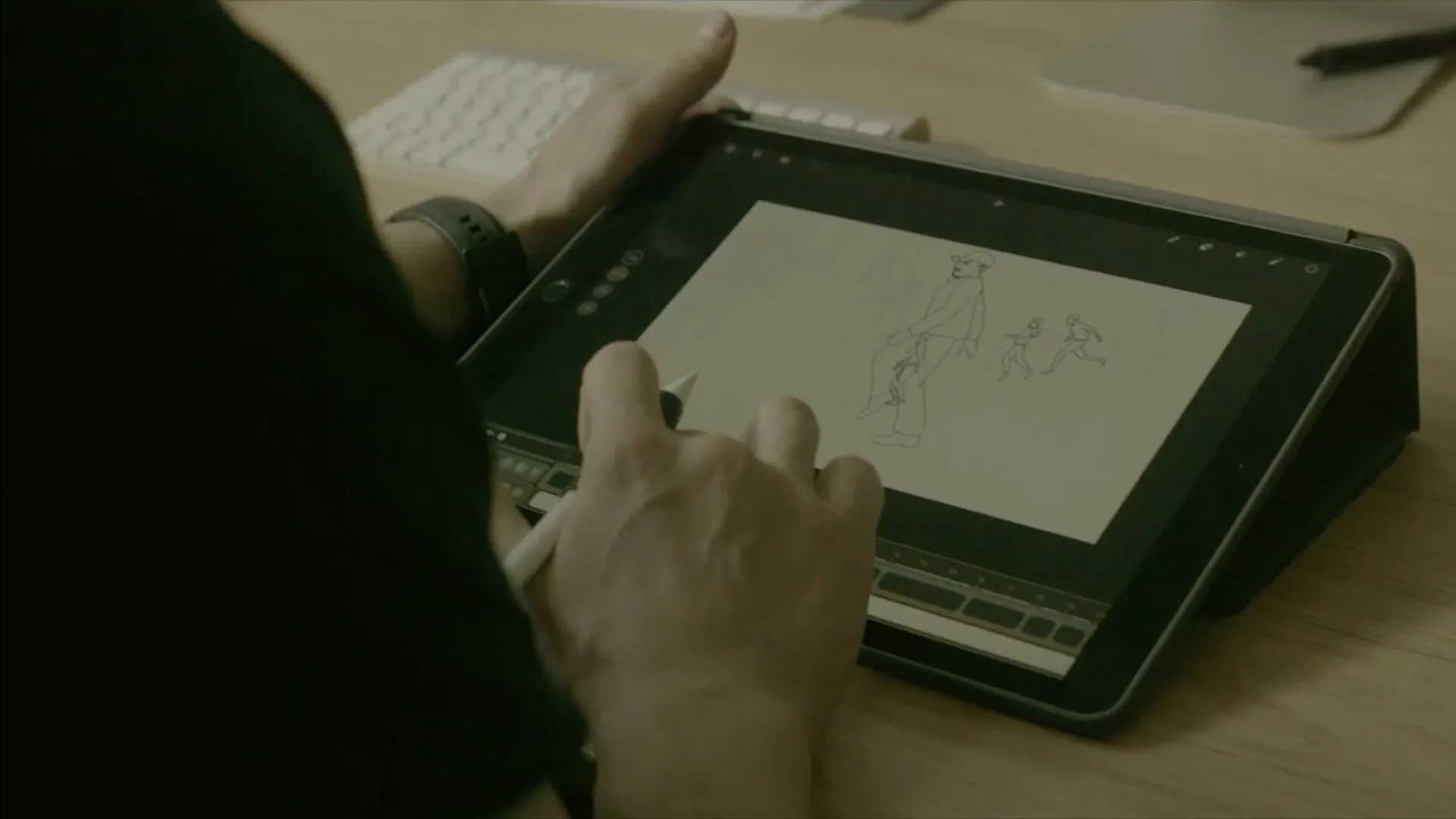 Behind the scenes — Kan Muftic hand-animating character sketches on a drawing tablet.